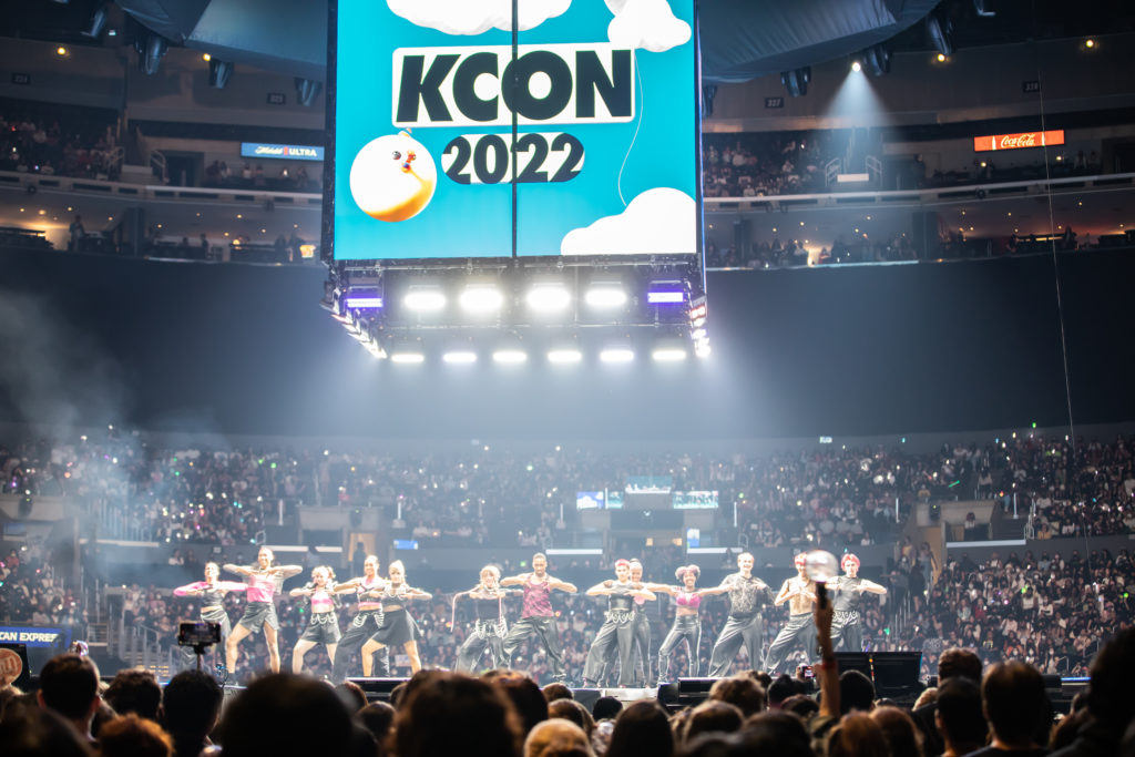 A group of dancers performing for a full stadium at L.A. KCON.