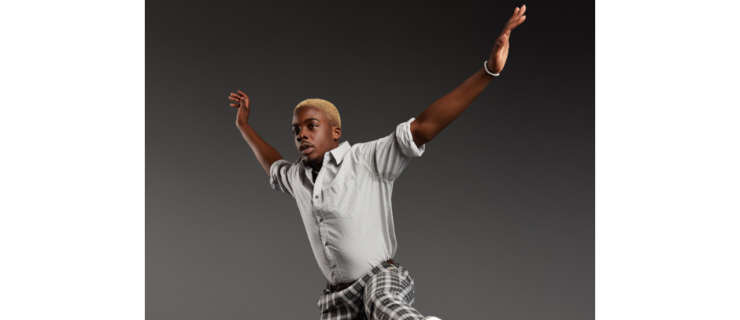 a male tap dancer jumping in the air