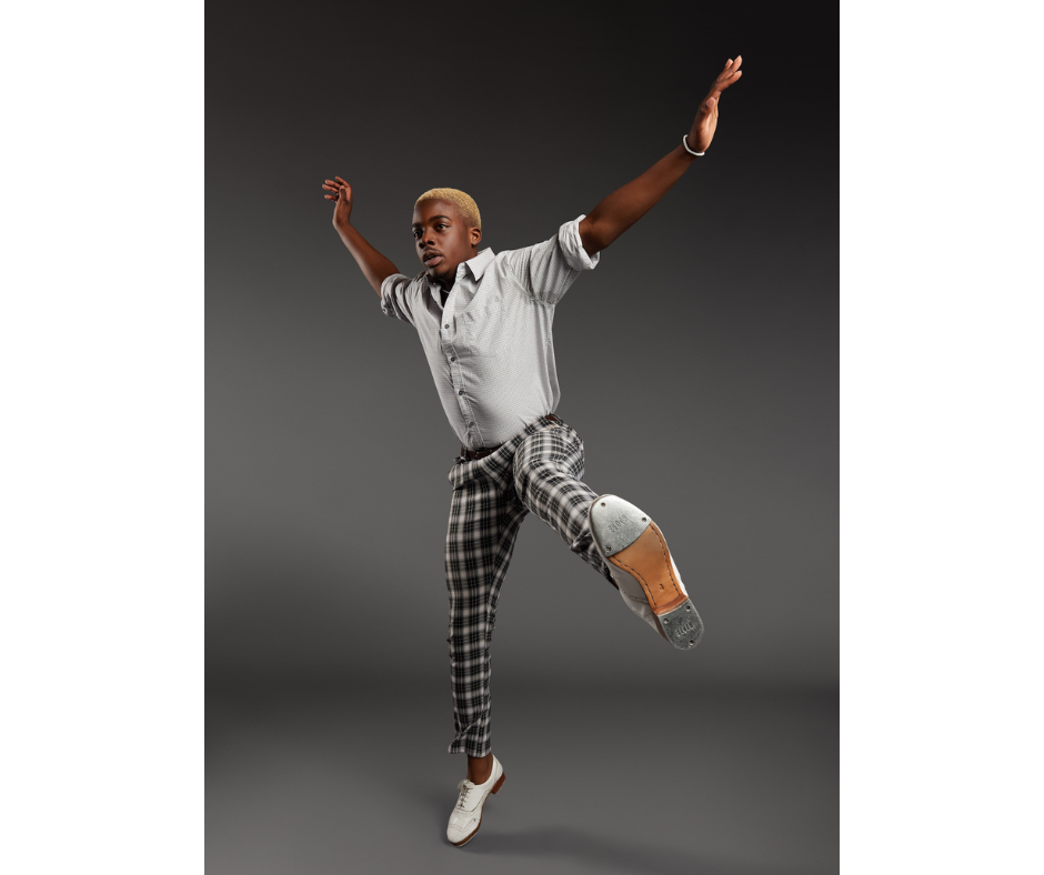 a male tap dancer jumping in the air