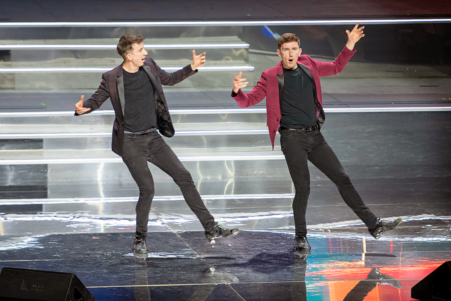 Gardiner Brothers performing in suits on stage.