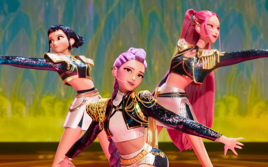 A still from "KPop Demon Hunters" showing three female K-Pop stars performing onstage.