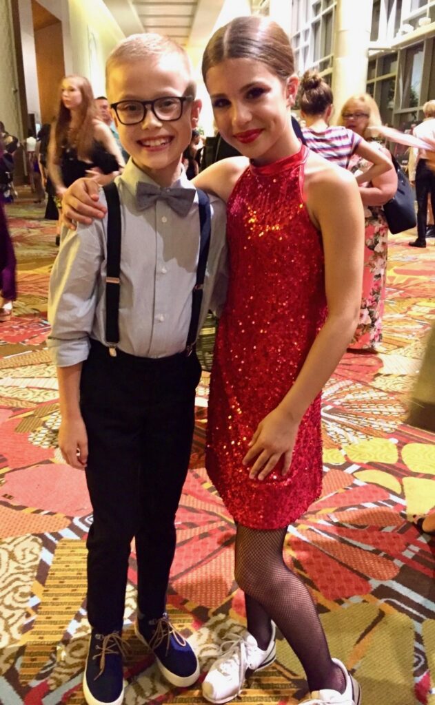 An old photo of Ian and Cameron, as children, posing together in costume at The Dance Awards.