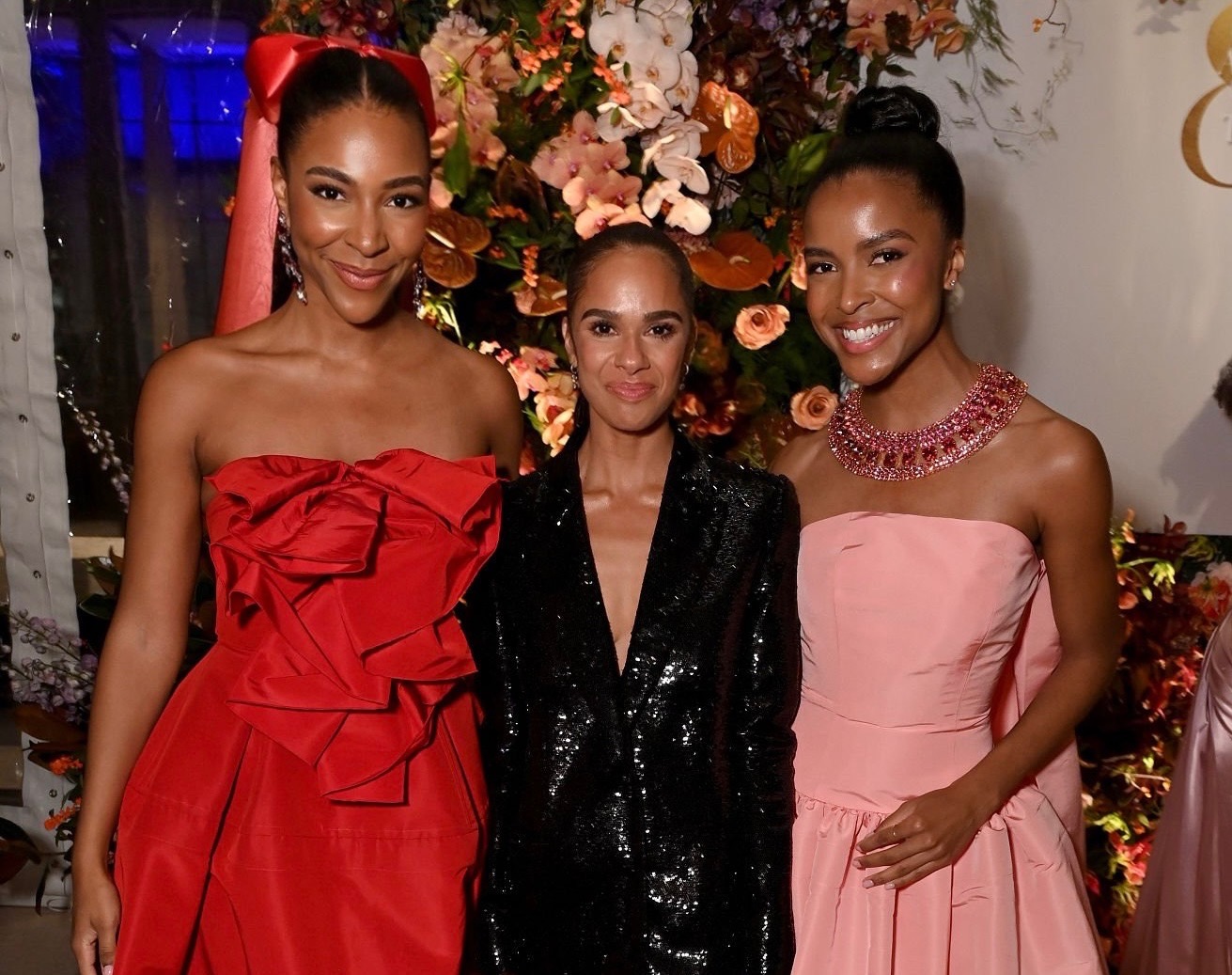 Nia Faith, Misty Copeland, and Justice Faith pose for a photo together wearing formal gala attire.